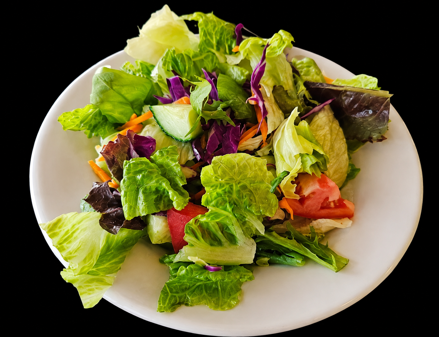Fresh garden salad with cucumber, tomato, red onion and olives